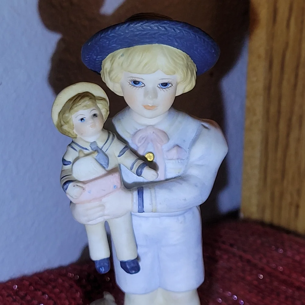 VINTAGE PORCELAIN BOY WITH DOLL FIGURINE 